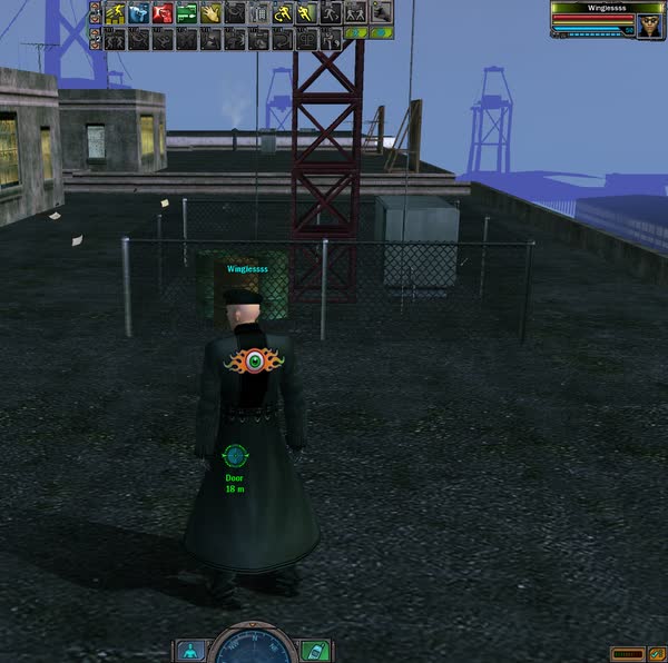 An operative on a fenced rooftop near the docks, with a red radio mast and harbour cranes in the background.